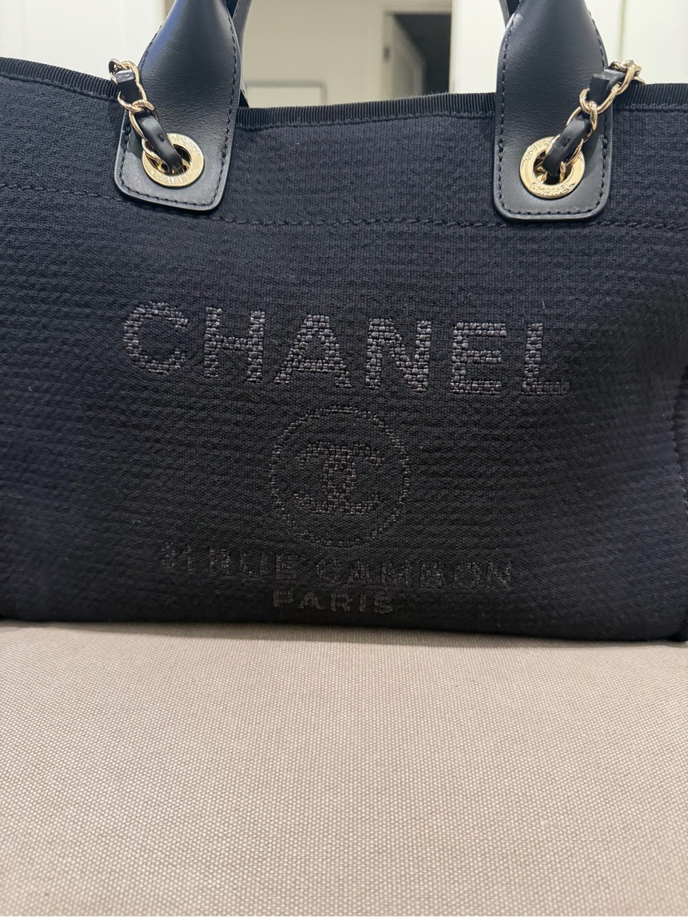 CHANEL Black Canvas Tote with Leather Handles and Gold Chain Accents - Picture 2 of 14